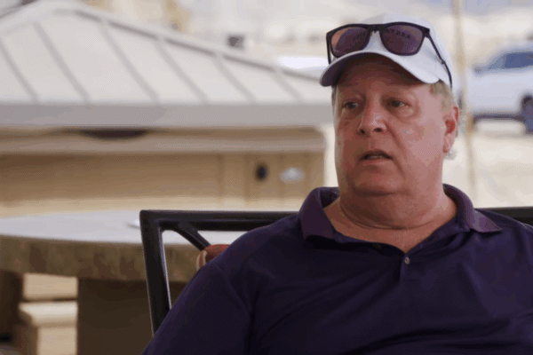 Chuck Potthast on 90 Day Fiance wearing his hat and glasses.