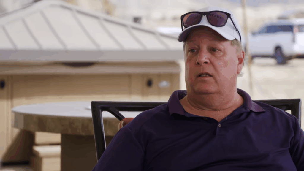 Chuck Potthast on 90 Day Fiance wearing his hat and glasses.