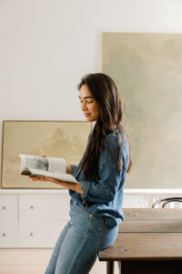 how to be creative - woman reading book in studio