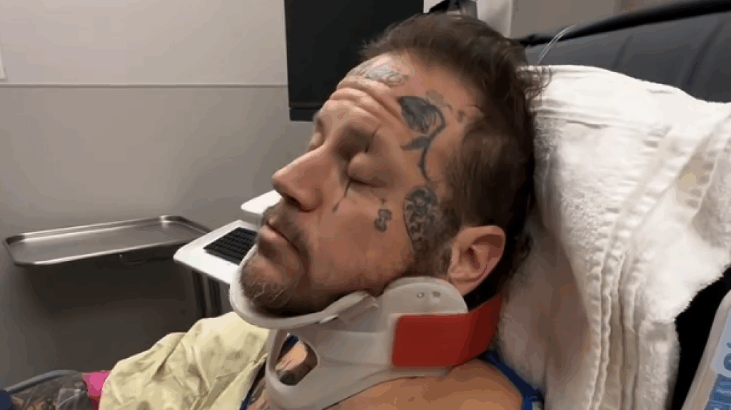 Jelly Roll in a neck brace in a hospital bed in January 2026.