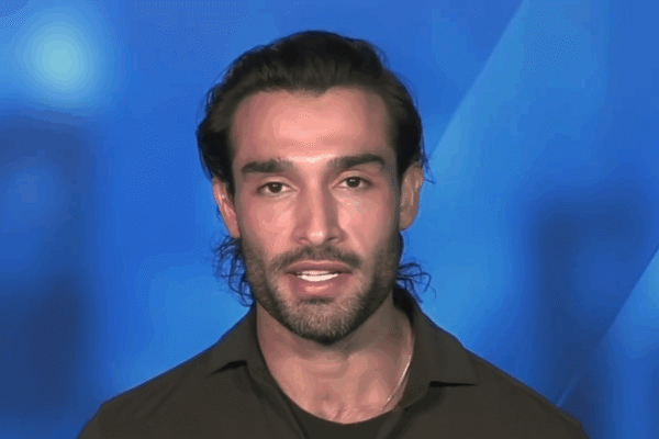 Sam Asghari speaks in from of a blue screen.