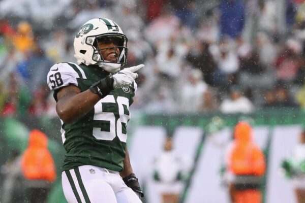 Inside linebacker Darron Lee #58 of the New York Jets celebrates a recovery by teammate  Jordan Jenkins #48 in the first quarter against the Atlanta Falcons at MetLife Stadium on October 29, 2017 in East Rutherford, New Jersey.
