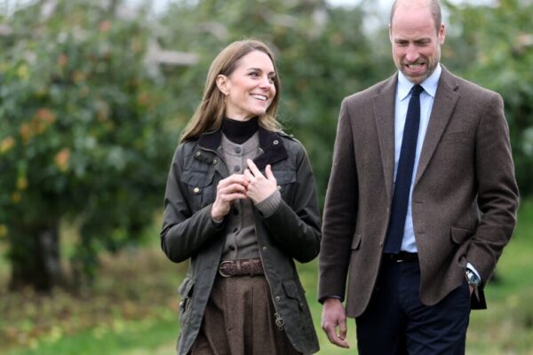 Catherine, Princess of Wales and Prince William, Prince of Wales walk in the orchards as they visit to Long Meadow Cider on October 14, 2025 in Craigavon, Northern Ireland.