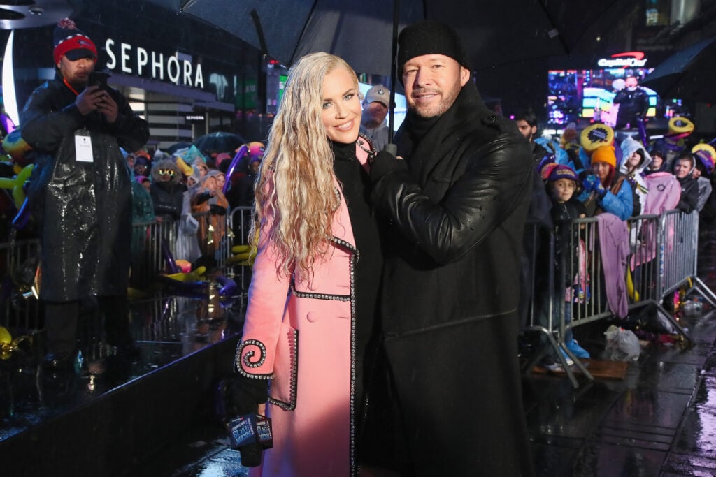 Jenny McCarthy and Donnie Wahlberg pose during Dick Clark