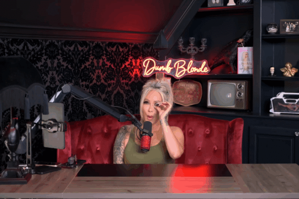 Bunnie Xo carefully wipes an eye on her podcast.