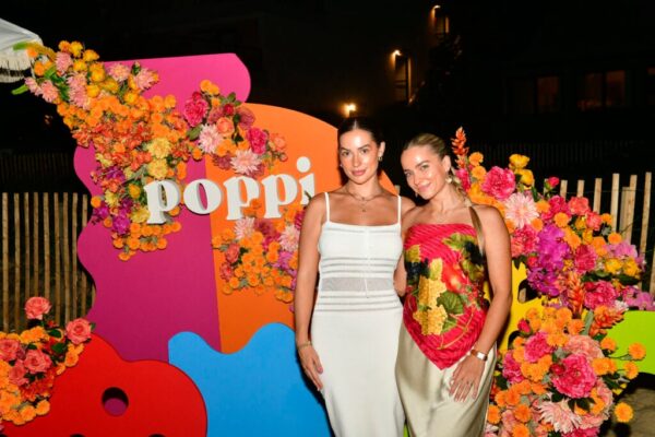 Avery Woods and Emilie Kiser attend the Poppi Soda