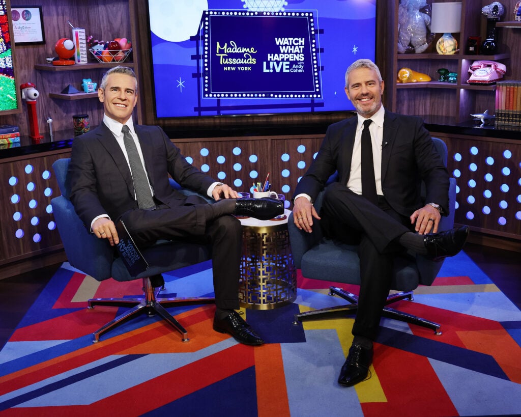 Andy Cohen poses side by side with his Madame Tussauds wax figure at the reveal of Andy Cohen Wax Figure In Perfectly Replicated âWatch What Happens Live With Andy Cohenâ Set at Madame Tussauds on August 15, 2024 in New York City.