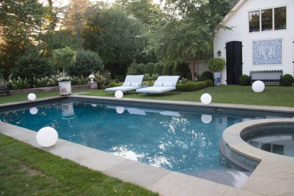 An in-ground pool in a backyard.
