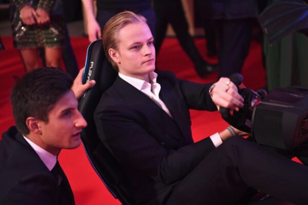 Mitch Evans (L) and Marius Borg Hoiby compete on the Formula E Simulator at the BRITS official aftershow party, in partnership with Tempus Magazine, at the Intercontinental London - The O2 on February 21, 2018 in London, England