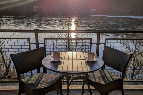 Morning coffee on your private balcony overlooking the Delaware River at River House at Odette