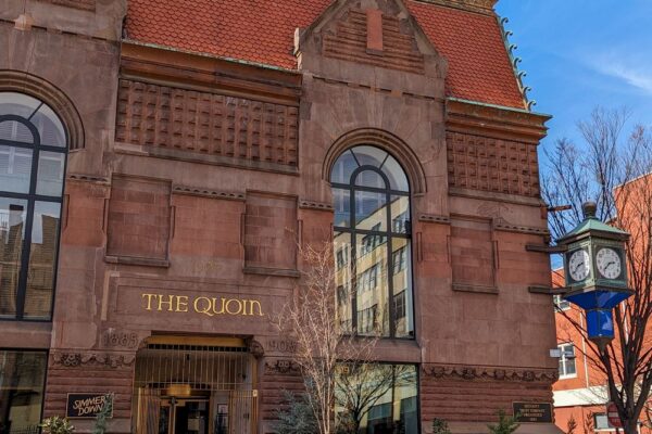 The exterior of The Quoin Hotel in Downtown Wilmington DE, a restored historic brownstone boutique luxury hotel