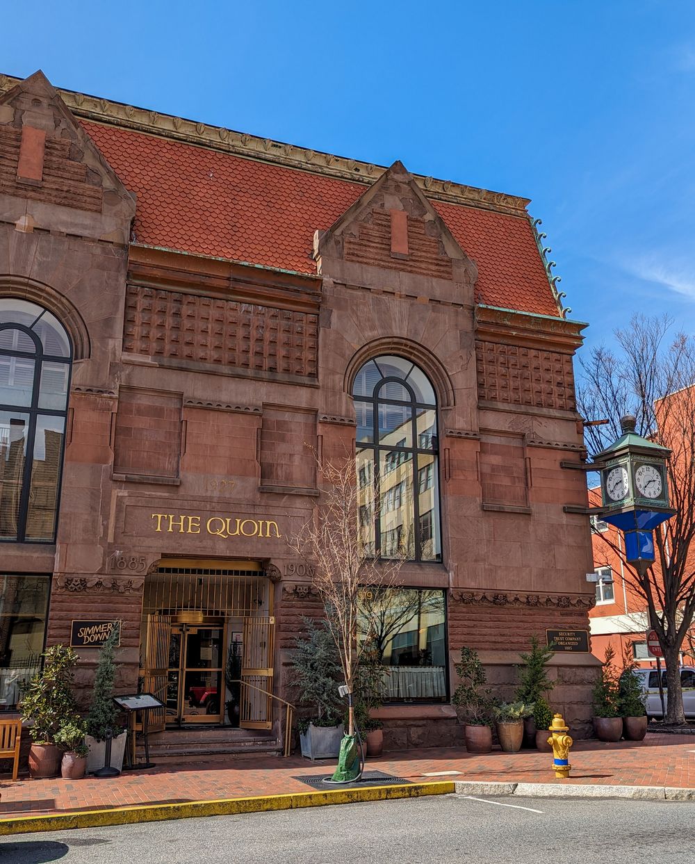 The exterior of The Quoin Hotel in Downtown Wilmington DE, a restored historic brownstone boutique luxury hotel