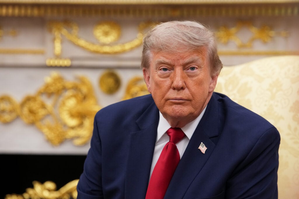 Donald Trump in his hideously decorated Oval Office.