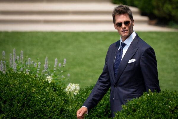 Quarterback Tom Brady arrives for a ceremony with U.S. President Joe Biden as he welcomes the 2021 NFL Super Bowl champions Tampa Bay Buccaneers to the South Lawn of the White House on July 20, 2021 in Washington, DC.