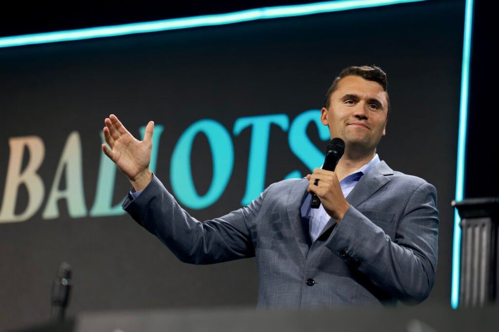 Charlie Kirk, who founded Turning Point USA, speaks before former President Donald Trump