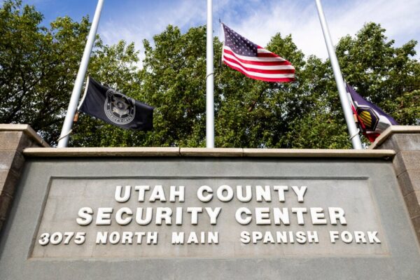 Flags fly at half-staff in front of the Utah County Security Center where 22-year-old Tyler Robinson, suspect in the killing political activist Charlie Kirk, is being held on September 12, 2025 in Spanish Fork, Utah.