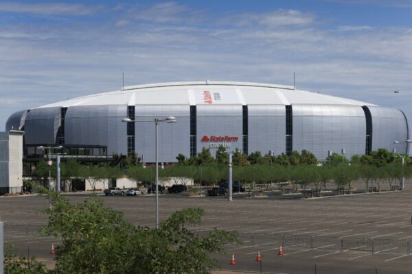 A Marine Helicopter Squadron One (HMX-1)(far right) prepares to fly past the State Farm Stadium, home of the Arizona Cardinals.