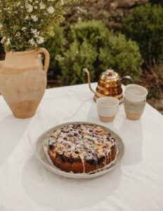 blueberry cornmeal cake with almond crumble and lemon glaze
